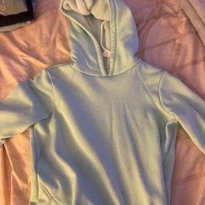 A girls 10-12 light blue athletic hoodie with a fuzzy hood
